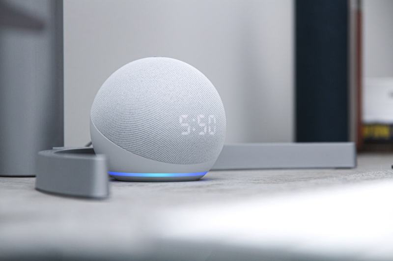 A small smart speaker on a bright shelf